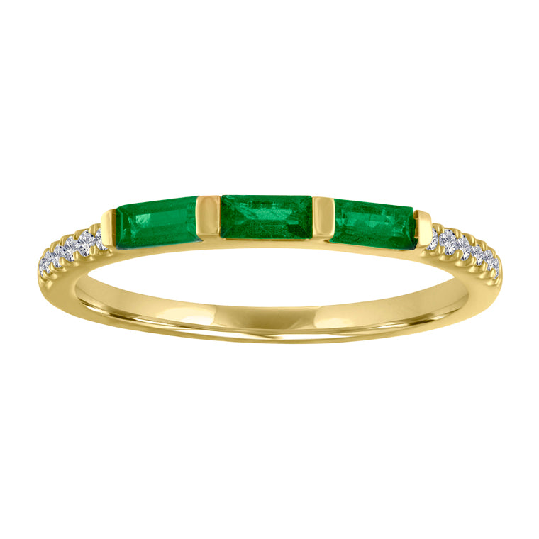 Yellow gold skinny band with three emerald baguettes and round diamonds on the shank. 