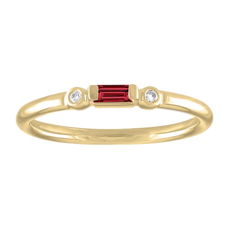 Yellow gold skinny band with a garnet baguette in the center and two round diamonds on the side. 