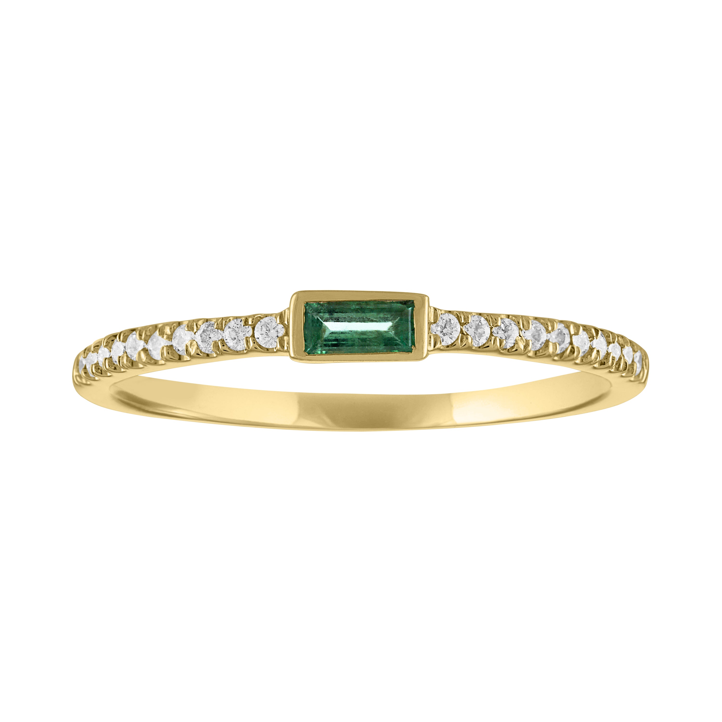 Yellow gold skinny band with a bezeled emerald baguette and round diamonds on the shank. 