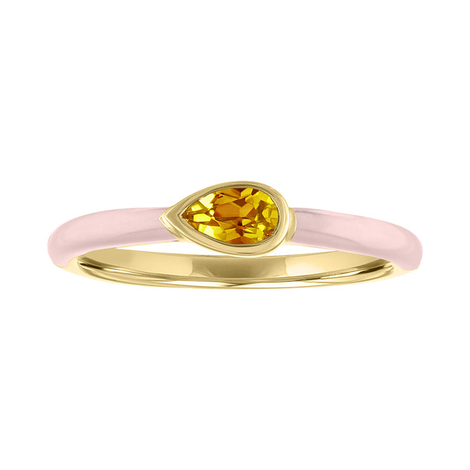 Yellow gold skinny band with pink enamel and a bezeled pear shaped citrine. 