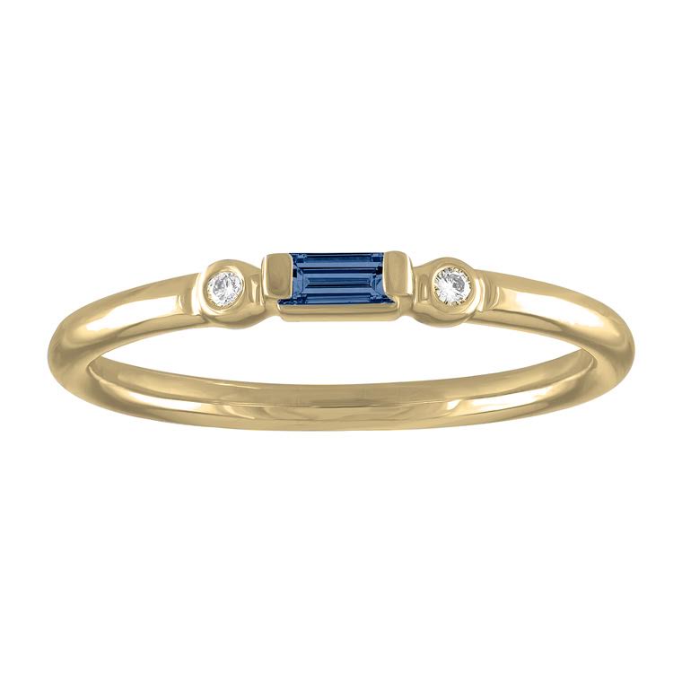 Yellow gold skinny band with a sapphire baguette in the center and two round diamonds on the side. 