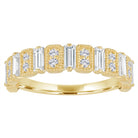 Yellow gold wide band with diamond baguettes and round diamonds.
